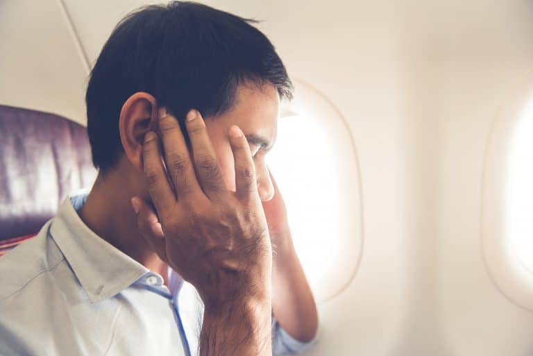 Man experiences ear pressure on plane.