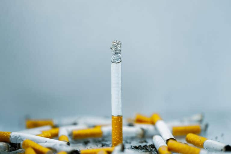 A bunch of cigarettes against a white background.